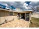 Rear patio with paver flooring offers a comfortable outdoor living space at 2191 Williamsburg Way, Englewood, FL 34224