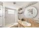 Bathroom featuring a single sink vanity, toilet, and shower with modern tile at 2545 Geneva Rd, Venice, FL 34293