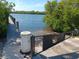 View of a public boat ramp and dock leading into calm water surrounded by mangrove trees at 2545 Geneva Rd, Venice, FL 34293