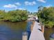Picturesque view of a public boat ramp and dock leading into calm water at 2545 Geneva Rd, Venice, FL 34293