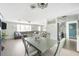 Open-concept living and dining area with wood-look floors, comfortable seating, and modern appliances at 2545 Geneva Rd, Venice, FL 34293