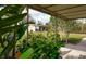 Enclosed patio with lush tropical plants creates a private and serene outdoor space at 2545 Geneva Rd, Venice, FL 34293