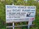 Sign for South Venice Beach Boat Ramp with information about access and security cameras at 2545 Geneva Rd, Venice, FL 34293
