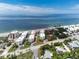 Aerial view of beachfront condos, nestled near tree lined streets in desirable location at 2820 N Beach Rd # 101, Englewood, FL 34223