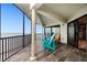 Inviting balcony with ocean views and comfortable Adirondack chairs at 2820 N Beach Rd # 101, Englewood, FL 34223
