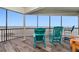 Relaxing balcony with ocean views and comfortable seating, perfect for enjoying the serene coastal atmosphere at 2820 N Beach Rd # 101, Englewood, FL 34223