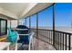 Beautiful balcony with ocean view featuring chairs and beach access at 2820 N Beach Rd # 101, Englewood, FL 34223