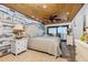 Comfortable bedroom featuring a king bed, ocean views, and nautical accents at 2820 N Beach Rd # 101, Englewood, FL 34223