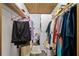 A closet with washer and dryer hookups features ample storage, perfect for organization and laundry at 2820 N Beach Rd # 101, Englewood, FL 34223