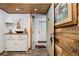 Inviting condo entrance showcasing coastal decor and providing access to comfortable living spaces within the beach community at 2820 N Beach Rd # 101, Englewood, FL 34223