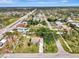Aerial view shows the property's layout and large lot, surrounded by mature trees at 35 Michigan Ave, Englewood, FL 34223