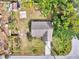 Overhead shot reveals the home's roof, the surrounding yard, and neighborhood at 35 Michigan Ave, Englewood, FL 34223