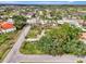 Neighborhood aerial view showcasing verdant landscaping, various houses, and community layout at 35 Michigan Ave, Englewood, FL 34223