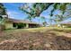 This large backyard features a screened porch, mature trees, and plenty of space at 35 Michigan Ave, Englewood, FL 34223