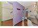A partially renovated bathroom with a modern vanity and a walk-in closet at 35 Michigan Ave, Englewood, FL 34223
