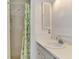 Bathroom featuring a shower with curtain and vanity sink at 35 Michigan Ave, Englewood, FL 34223