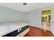 Bedroom with small window, access to a closet and view to hallway and other rooms at 35 Michigan Ave, Englewood, FL 34223