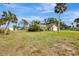 Well-maintained single-Gathering home on a spacious lot with mature landscaping and clear blue skies at 35 Michigan Ave, Englewood, FL 34223