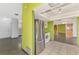 Modern kitchen with stainless steel refrigerator and view to dining area at 35 Michigan Ave, Englewood, FL 34223