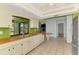 Bright kitchen features a stainless steel refrigerator and large view window at 35 Michigan Ave, Englewood, FL 34223