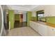 Well-lit kitchen with view to dining area and stainless steel appliances at 35 Michigan Ave, Englewood, FL 34223