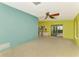Open floor plan with views of kitchen and slider to back yard and tile flooring throughout at 35 Michigan Ave, Englewood, FL 34223