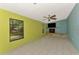 Bright living room area featuring a decorative fireplace and large windows at 35 Michigan Ave, Englewood, FL 34223