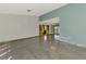Open living room with polished floors, unique built-in display cabinets, and ample space at 35 Michigan Ave, Englewood, FL 34223