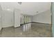 Spacious living room with a smooth floor and ample natural light from the many windows at 35 Michigan Ave, Englewood, FL 34223