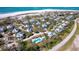 Aerial view of the property with the home highlighted, showcasing its location in a community with a pool nearby at 36 Seawatch Dr, Boca Grande, FL 33921