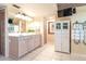 Bright bathroom with double sink vanity, cabinets, and tiled floors at 36 Seawatch Dr, Boca Grande, FL 33921