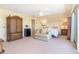 Bright bedroom with a sitting area, walkout access, and neutral tones at 36 Seawatch Dr, Boca Grande, FL 33921