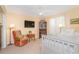 Relaxing bedroom featuring a cozy chair, wooden furniture and carpeted floor at 36 Seawatch Dr, Boca Grande, FL 33921