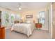 Bright bedroom with a large window offering ample natural light and a ceiling fan at 36 Seawatch Dr, Boca Grande, FL 33921