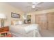 Cozy bedroom with a double bed, ceiling fan, and a view to a ensuite bath at 36 Seawatch Dr, Boca Grande, FL 33921
