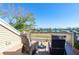 Relaxing deck with lounge chairs, table, and water views at 36 Seawatch Dr, Boca Grande, FL 33921