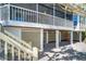 Exterior view of a large deck with stairs and lattice at 36 Seawatch Dr, Boca Grande, FL 33921