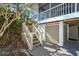 Exterior view of staircase leading to the deck and front door at 36 Seawatch Dr, Boca Grande, FL 33921
