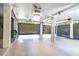 Spacious garage with white columns, bright lighting and lattice-covered opening at 36 Seawatch Dr, Boca Grande, FL 33921