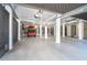 Large garage featuring a golf cart, white support pillars, and bright overhead lighting at 36 Seawatch Dr, Boca Grande, FL 33921