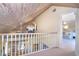 Bright hallway with high wood ceilings leading to a sunroom and upstairs office at 36 Seawatch Dr, Boca Grande, FL 33921
