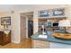 Bright kitchen featuring light wood cabinets and unique stained glass window details at 36 Seawatch Dr, Boca Grande, FL 33921