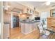 Bright kitchen with stainless steel appliances and an adjacent casual dining area at 36 Seawatch Dr, Boca Grande, FL 33921