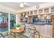 Well-lit kitchen with a casual dining area, offering views to the outdoor patio at 36 Seawatch Dr, Boca Grande, FL 33921