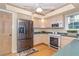 Cozy kitchen with stainless steel appliances and a casual design at 36 Seawatch Dr, Boca Grande, FL 33921