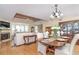 Open-concept living and dining room with hardwood floors and natural light at 36 Seawatch Dr, Boca Grande, FL 33921