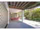 Covered patio with outdoor seating at 36 Seawatch Dr, Boca Grande, FL 33921