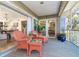 Inviting patio area featuring comfortable wicker furniture and open access to the home's interior at 36 Seawatch Dr, Boca Grande, FL 33921