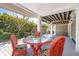 Outdoor seating on a covered patio at 36 Seawatch Dr, Boca Grande, FL 33921