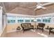Bright sunroom with multiple windows showing views of the water at 36 Seawatch Dr, Boca Grande, FL 33921